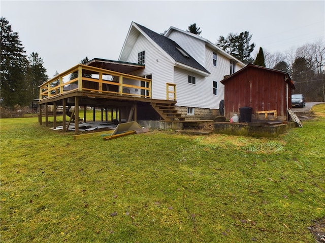 back of house with a lawn and a deck