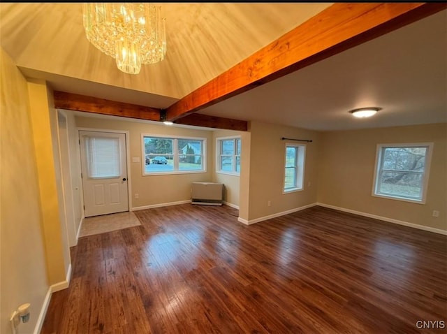 entryway with dark hardwood / wood-style flooring, beamed ceiling, and a notable chandelier