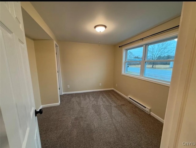 carpeted spare room featuring a baseboard radiator