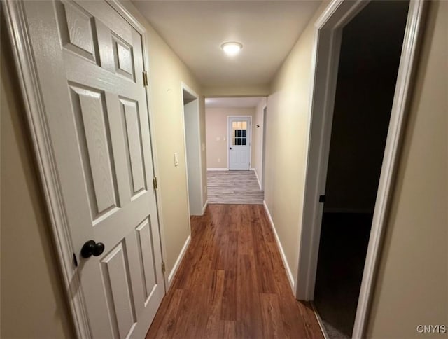 hallway featuring dark wood-type flooring