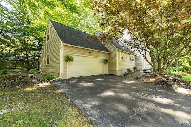 view of home's exterior with a garage