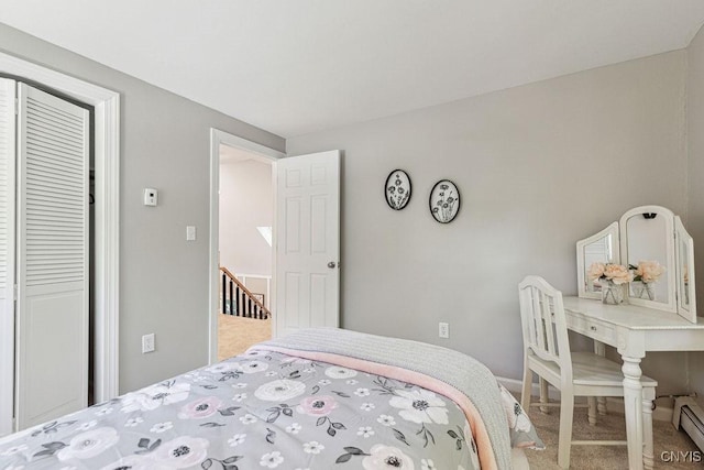 bedroom featuring carpet and a closet