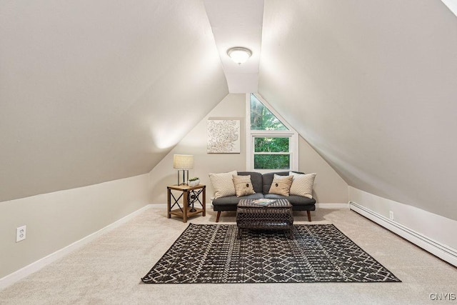 living area with carpet flooring, vaulted ceiling, and baseboard heating