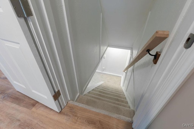 staircase featuring hardwood / wood-style floors