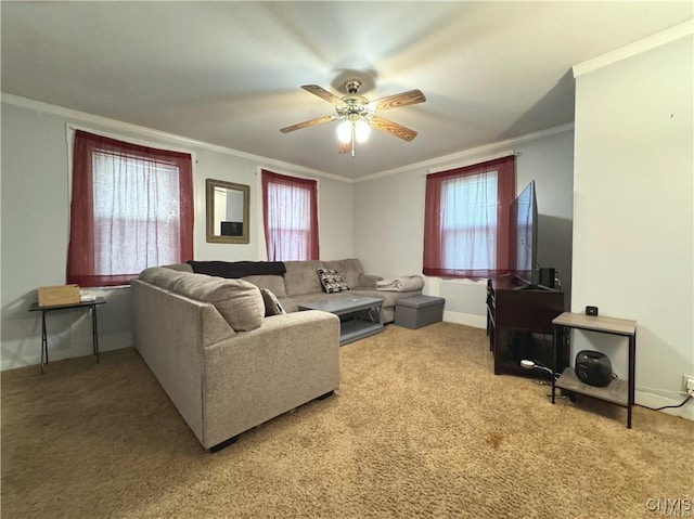 carpeted living room featuring crown molding and ceiling fan