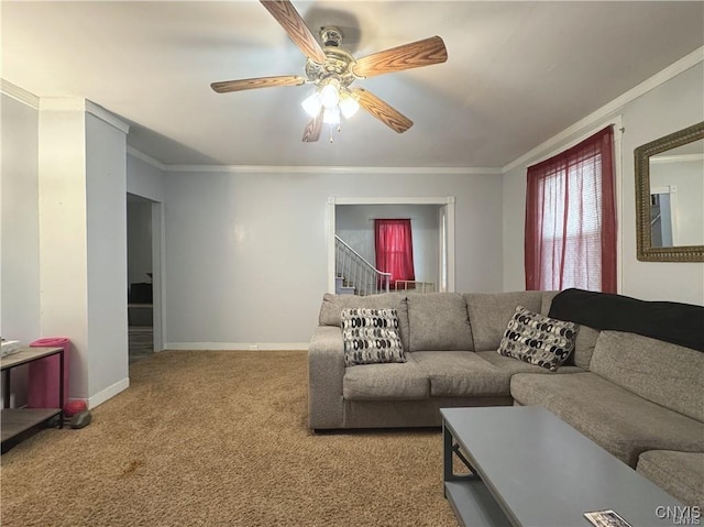 living room featuring ceiling fan, crown molding, and light carpet