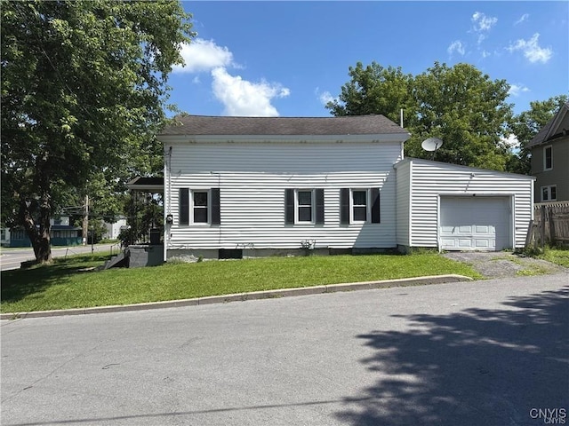 view of front facade with a garage and a front lawn