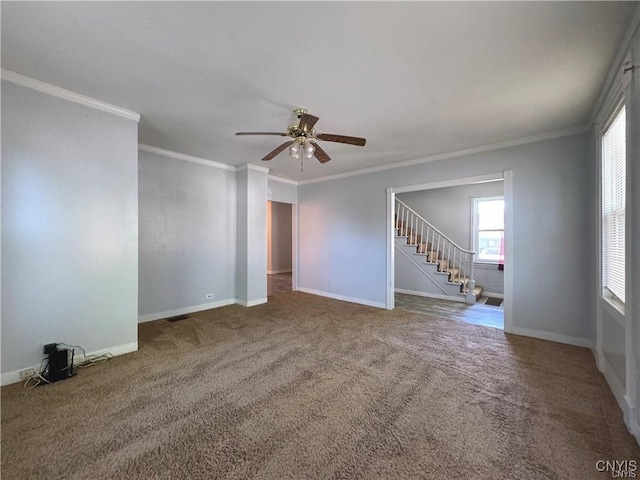 unfurnished room with carpet, ceiling fan, and crown molding