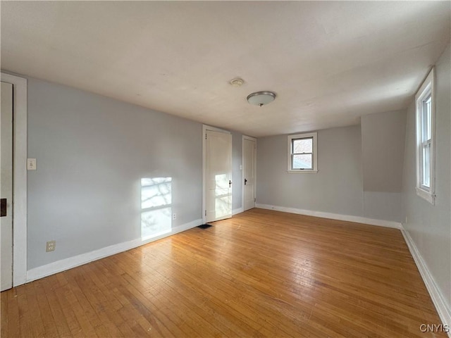 spare room featuring light hardwood / wood-style flooring