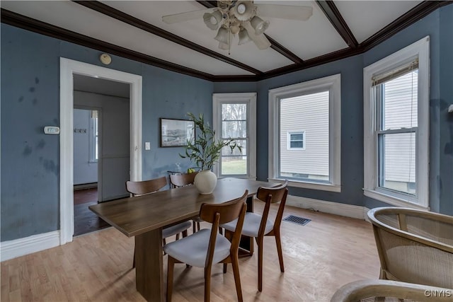 dining area with light hardwood / wood-style flooring, ceiling fan, and ornamental molding