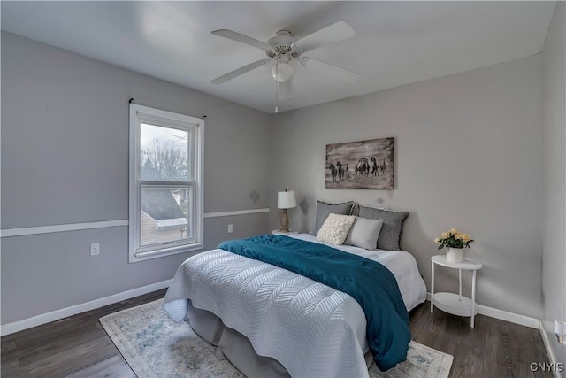 bedroom featuring ceiling fan and dark hardwood / wood-style flooring