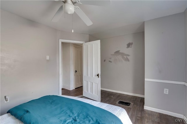 bedroom with ceiling fan and dark hardwood / wood-style flooring