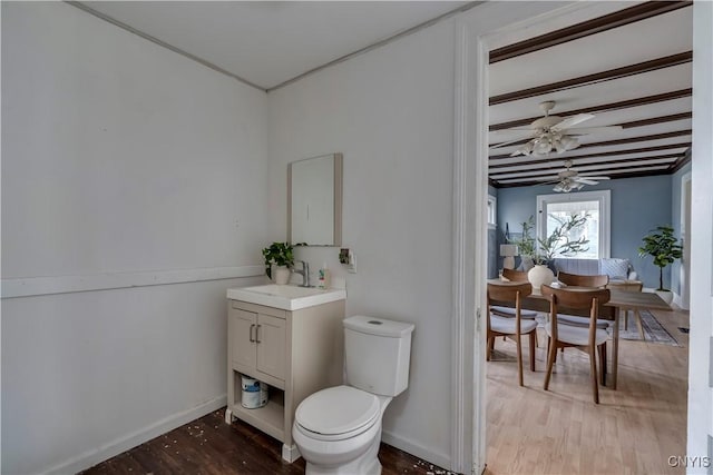 bathroom featuring hardwood / wood-style floors, vanity, toilet, and ceiling fan