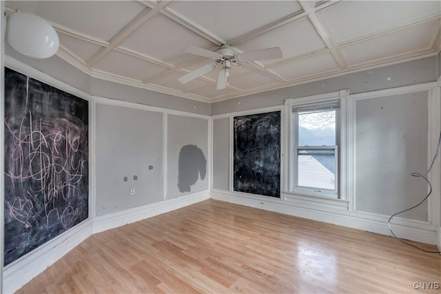 unfurnished room featuring ceiling fan, hardwood / wood-style floors, and coffered ceiling