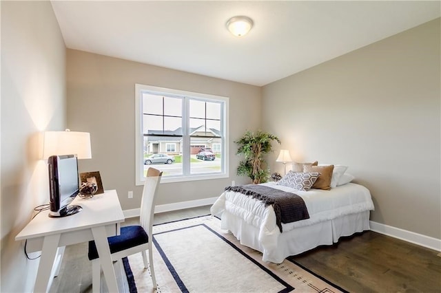 bedroom with wood-type flooring