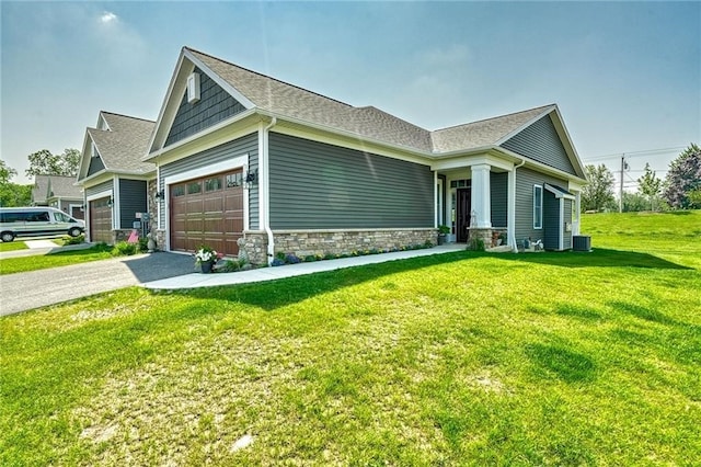 view of side of home featuring a garage, central AC unit, and a lawn