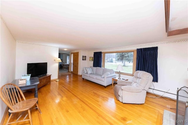 living room with hardwood / wood-style floors and a baseboard radiator