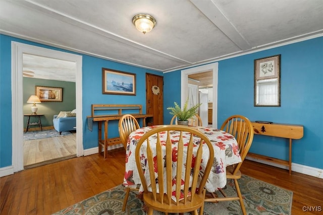 dining area with dark wood-type flooring