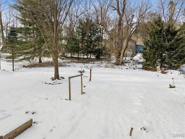 view of yard layered in snow