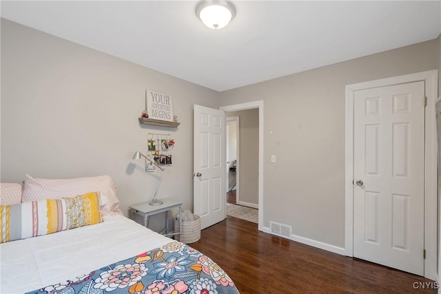 bedroom featuring dark hardwood / wood-style floors