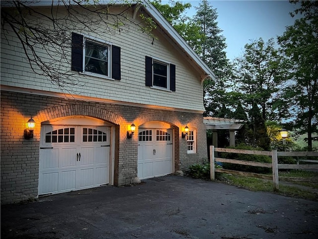 property exterior at dusk with a garage