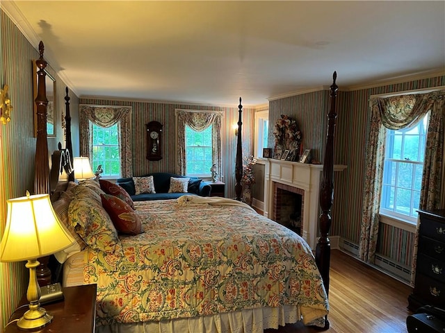 1470 State Route 19, Middlebury, NY 14591 - bedroom with multiple windows, wood finished floors, ornamental molding, a fireplace, and wallpapered walls
