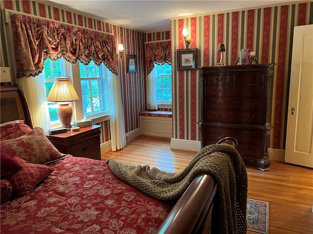 1470 State Route 19, Middlebury, NY 14591 - bedroom featuring wallpapered walls, light wood finished floors, and ornamental molding