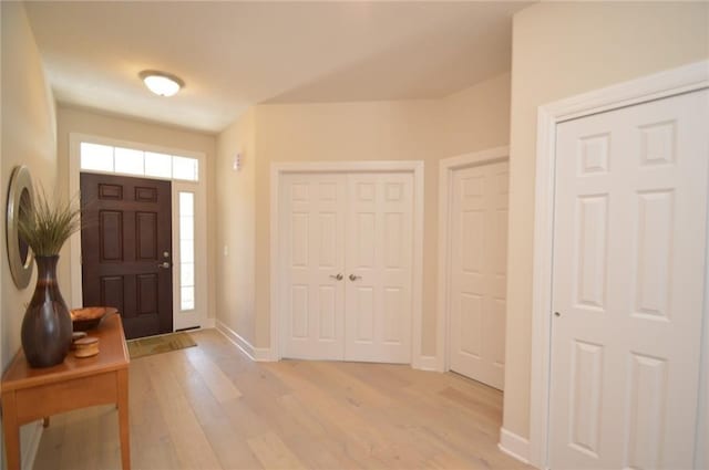 foyer entrance with light hardwood / wood-style flooring