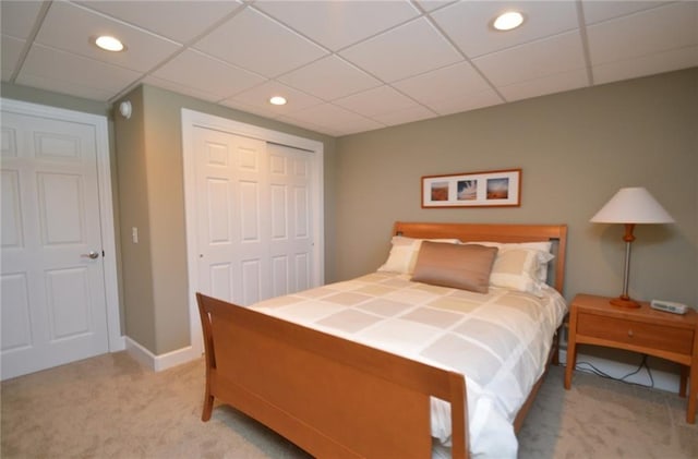 carpeted bedroom with a closet