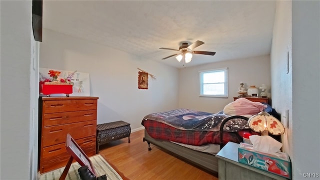 bedroom featuring ceiling fan and hardwood / wood-style floors