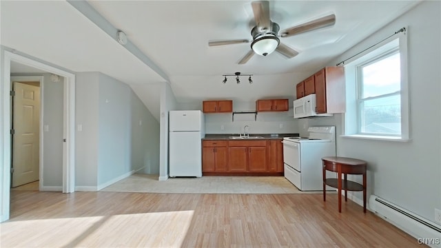 kitchen featuring white appliances, ceiling fan, baseboard heating, sink, and light hardwood / wood-style flooring