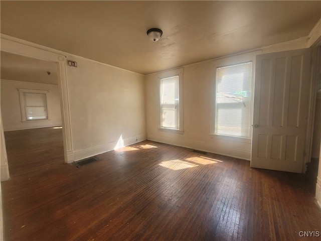 empty room featuring dark wood-type flooring