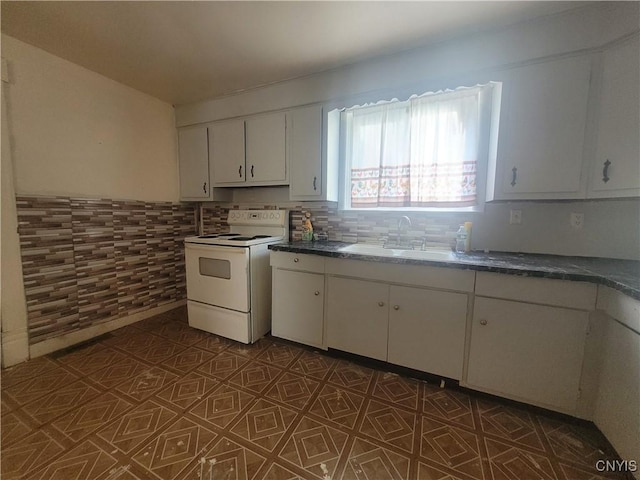 kitchen with white cabinets, white range with electric stovetop, and sink