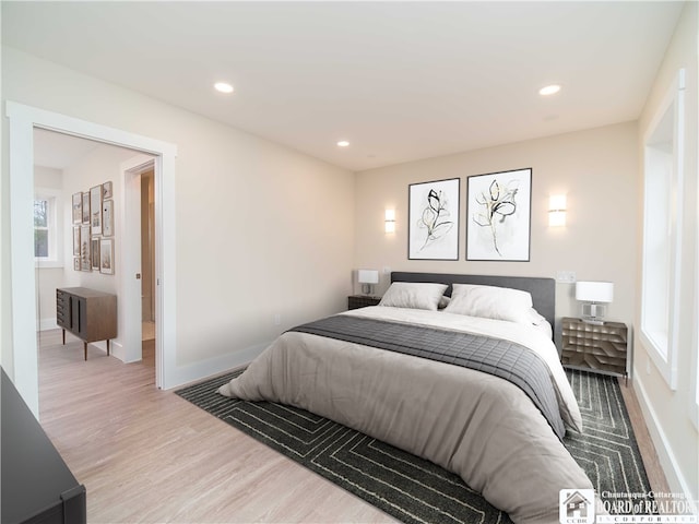 bedroom with hardwood / wood-style floors