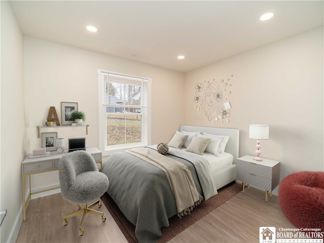 bedroom featuring hardwood / wood-style flooring