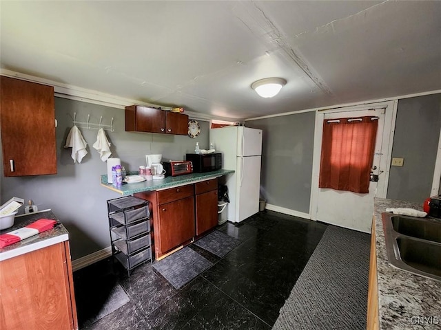 kitchen with white fridge and sink