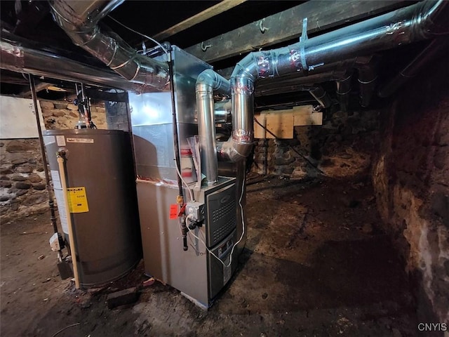 utility room featuring water heater