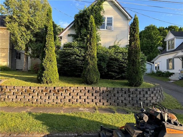 view of home's exterior with a yard