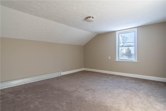 bonus room featuring a textured ceiling, carpet floors, and baseboard heating