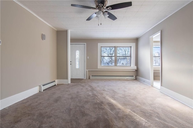 interior space with carpet, ceiling fan, and a baseboard heating unit