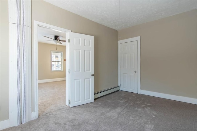 unfurnished bedroom with a textured ceiling, ceiling fan, light carpet, and a baseboard heating unit