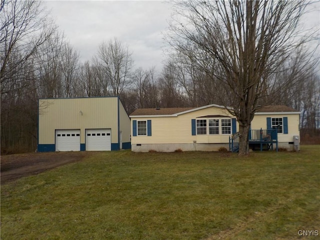 view of front of house featuring a garage and a front yard