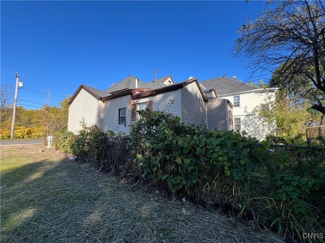 view of home's exterior featuring a yard