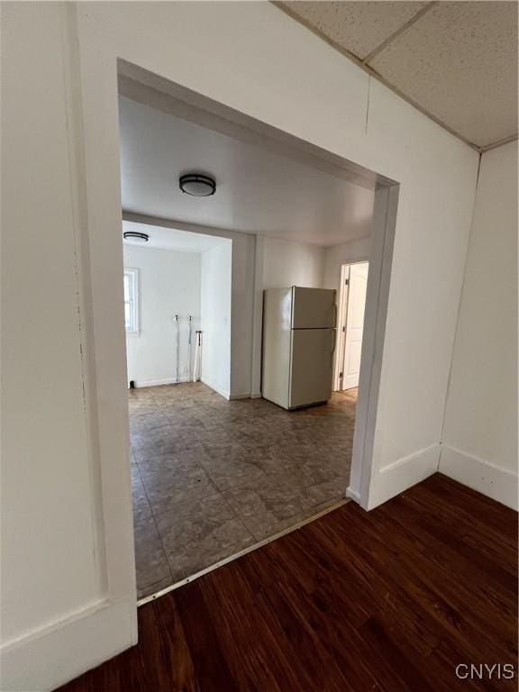 hallway featuring dark hardwood / wood-style flooring