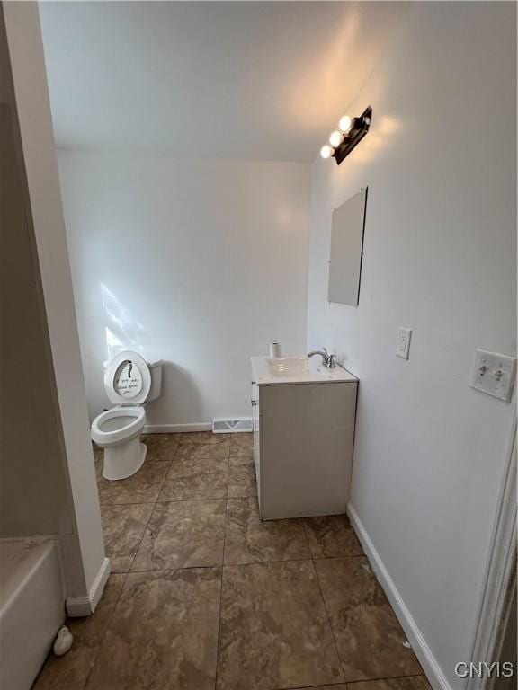 bathroom with vanity, electric panel, and toilet