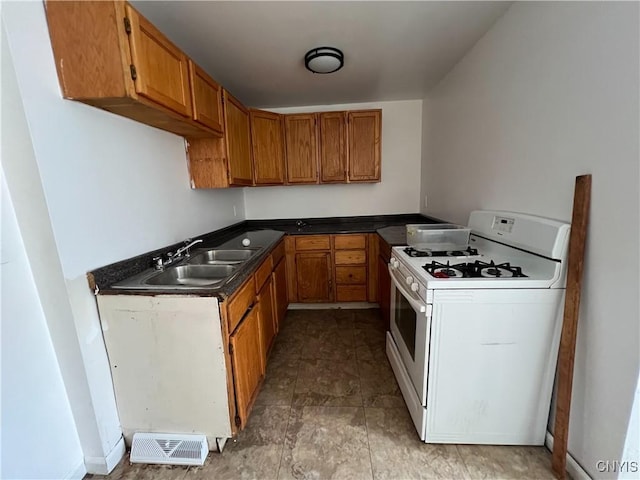 kitchen with sink and gas range gas stove