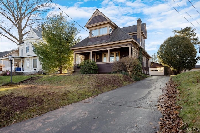 view of front of house with covered porch and a front yard