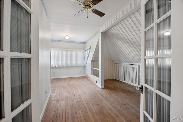 bonus room featuring ceiling fan and hardwood / wood-style flooring