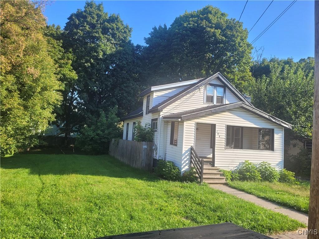 bungalow-style house with a front yard