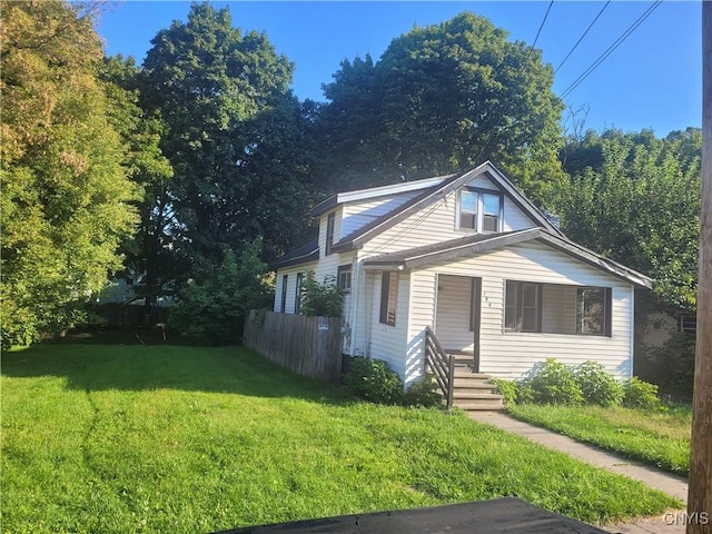 bungalow-style house with a front yard